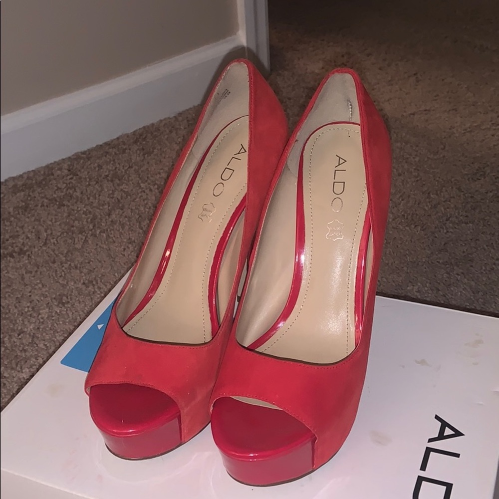 Red suede ALDO pumps.